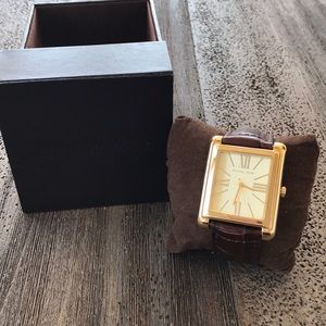 Gold Michael Kors watch. Brown snake skin band.